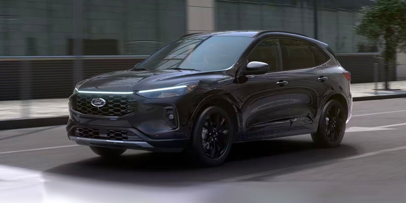 2024 Ford Escape driving fast through city