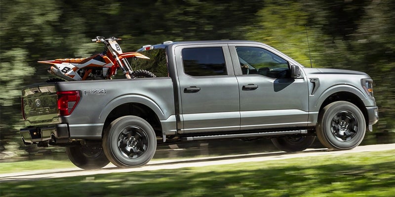2024 Ford F-150 driving on a road